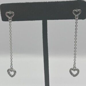 Silver colored rhinestone heart dangle earrings by Express